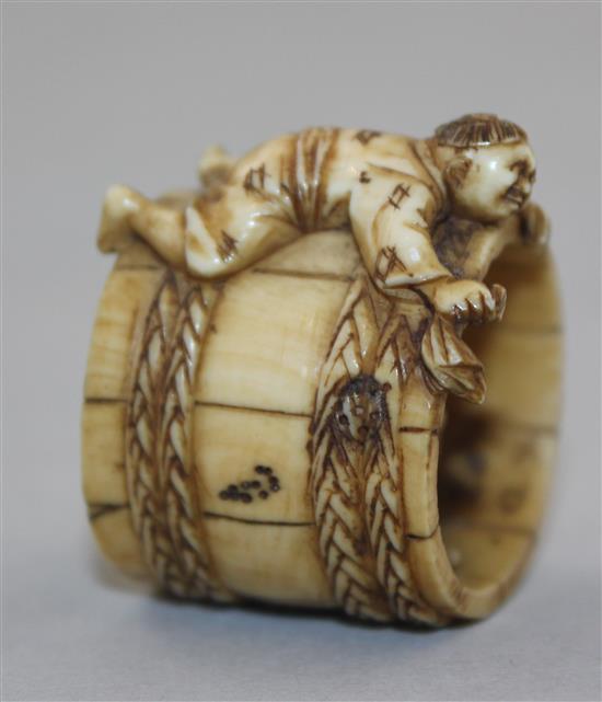 A Japanese ivory netsuke of two men constructing a barrel, Meiji period, 2.8cm